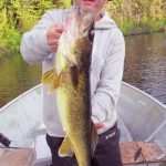 Man posing with a walleye