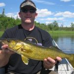 Man posing with a walleye