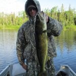 Man posing with a pike