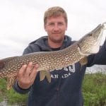 Man holding a pike