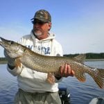 Man holding a pike