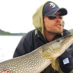 Man posing with a pike