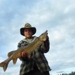 boy holding a pike