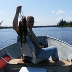 Man posing with several walleye