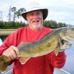 Man Posing with a Walleye
