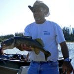Man posing with a monster walleye