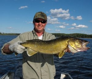 Man Posing with a Walleye